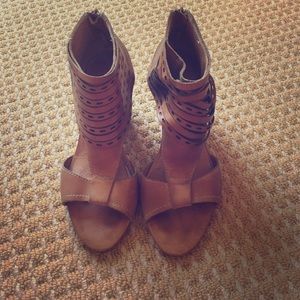 Tan open toed booties.