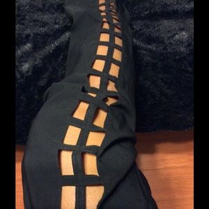 Black stretch pants with opening on both sides.