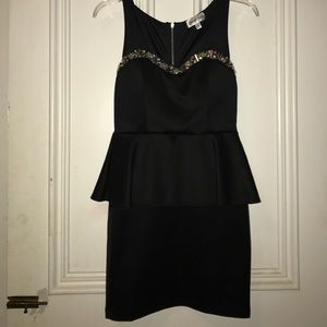 Simple black dress with a hint of gem