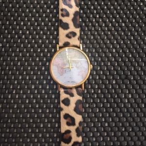 Leopard watch with globe face