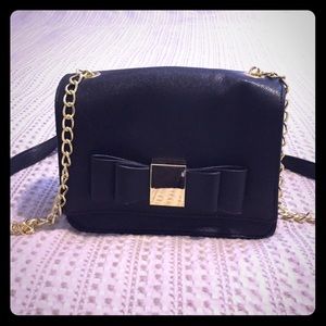 Small black handbag with gold detail