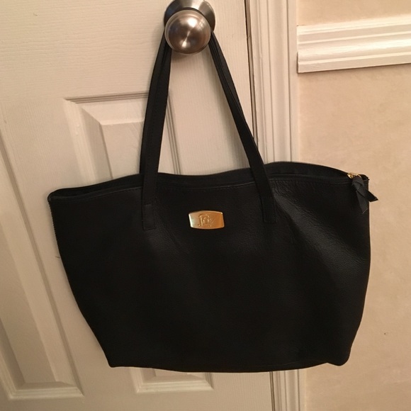 Joy black purse would hold smaller laptop.