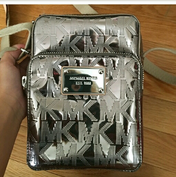 Micheal kors Handbags - MK SILVER SIDE PURSE!  VERY ROOM MK MONOGRAMMED!