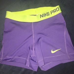 Light purple and green Nike pros
