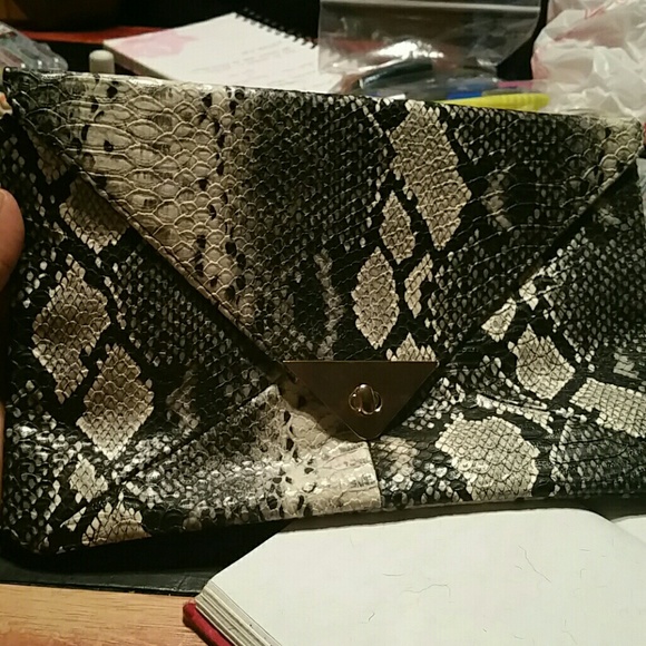 Brand new snake print clutch