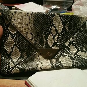 Brand new snake print clutch