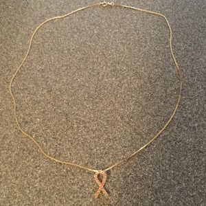Gold filled necklace w/ pink breast cancer symbol