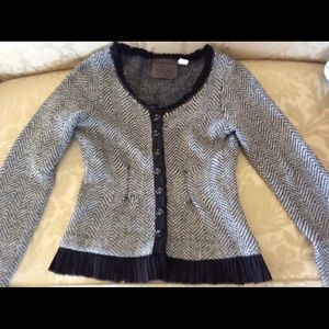 Fitted angora blend cardigan with pleated detail.