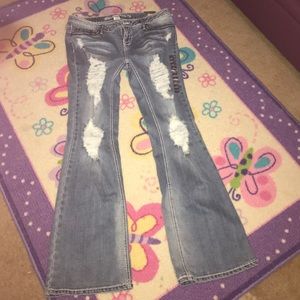 Brand new distressed jeans.