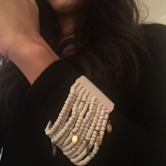Express ivory with brass charms bracelet