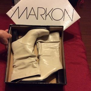 Ivory slip on ankle heeled boots