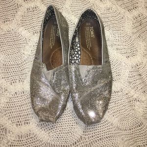 Silver Toms slip-ons