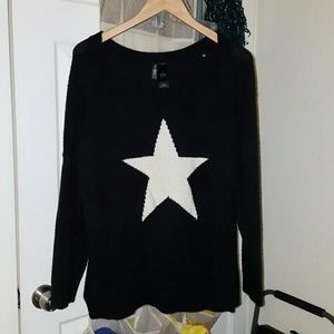 Knitted black sweater with a white star