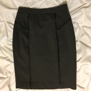 Grey pencil skirt with black accent.