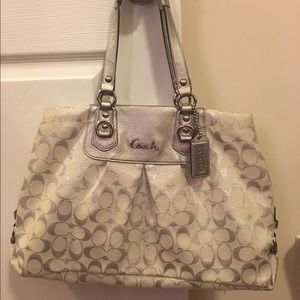 White and silver Coach purse