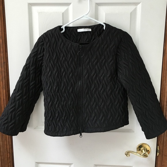Black cropped quilted jacket.