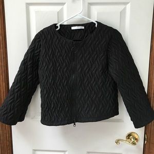 Black cropped quilted jacket.