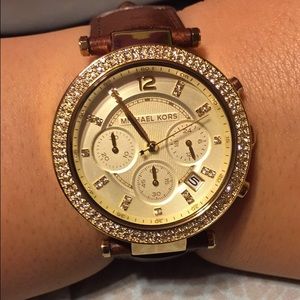Woman's mk gold tone glitz Parker
