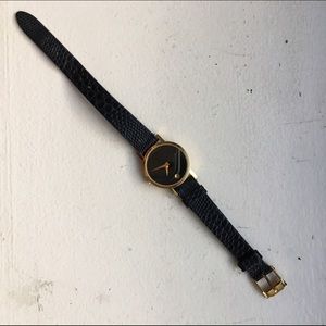 Movado black and gold ladies watch