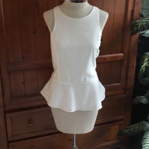 Express off white sleeveless peplum shirt.