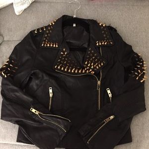 Gold studded leather jacket.