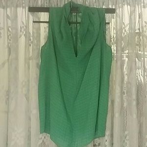 Green Cabi tank with geometric shapes.