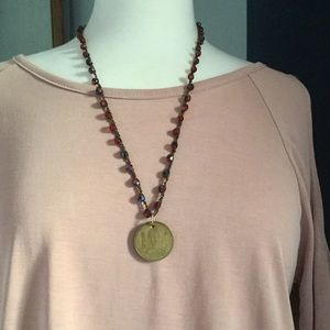 Crochet beaded necklace with coin pendant