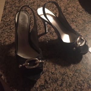 Black GUESS pumps with silver buckle
