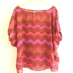 Fun patterned top with criss cross on sleeves