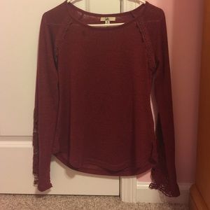 Red sweater with crochet sleeves