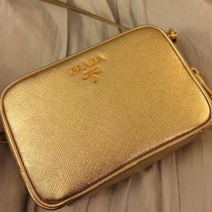 Authentic PRADA metallic saffiano mini cross bag.