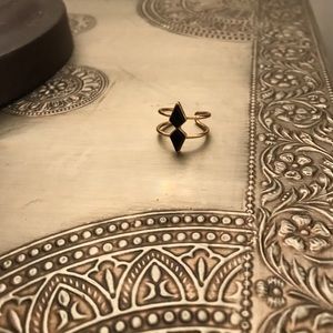 Gold ring with black stones