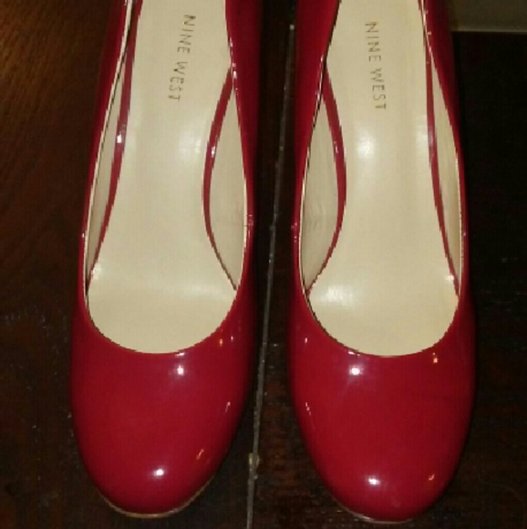 Nine West red patent leather pumps.