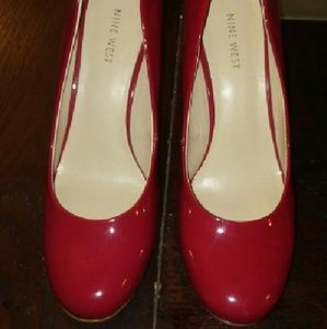 Nine West red patent leather pumps.