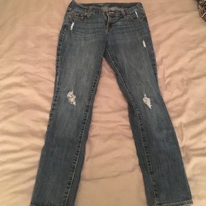 Petite worn out skinny jeans