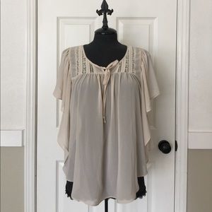 Super cute flowy cream colored top!