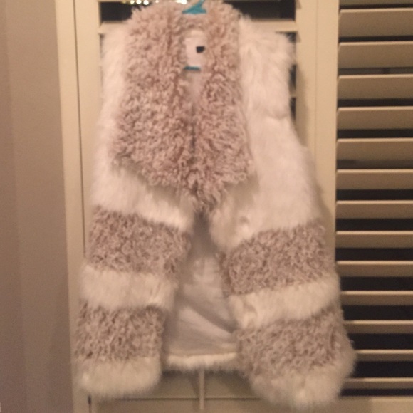 White fur vest