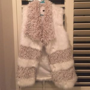 White fur vest