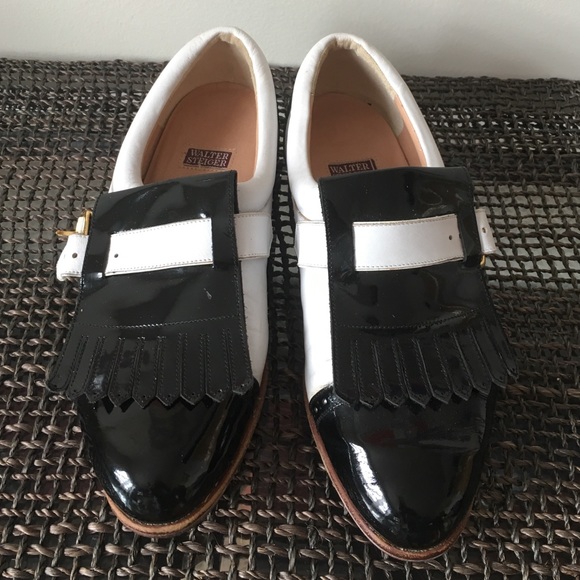 Black patent leather and white leather shoes