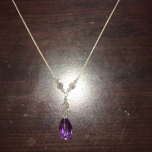 Sliver necklace with a purple crystal