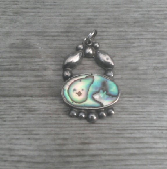 Vintage sterling and abalone charm.