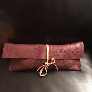 Burgundy leather clutch bag