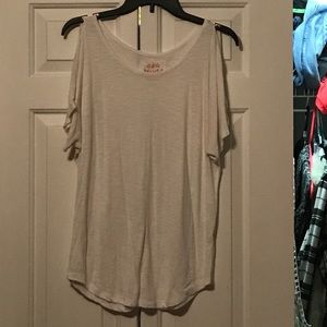 White "cold shoulder" top with cutout shoulders.