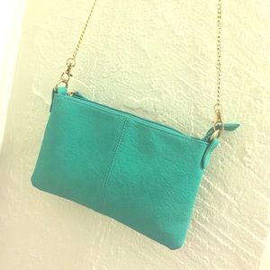 Turquoise blue cross body bag with gold chain