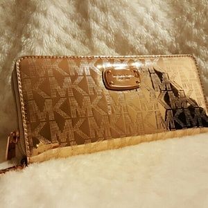 MK Rose gold mirrored wallet.
