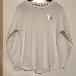 PINK White sweater with black leggings.