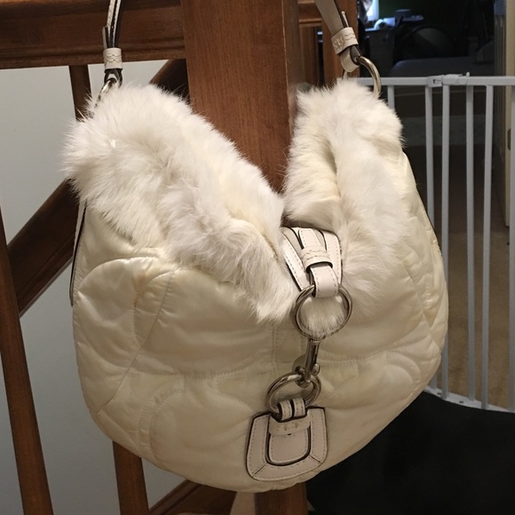 White coach purse with soft fur