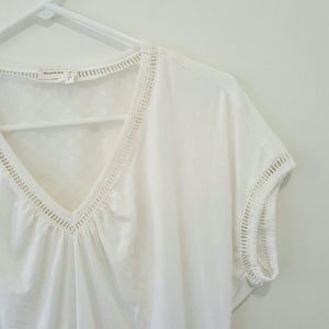 Anthropologie ivory top with detailed back