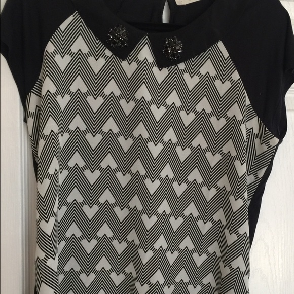 Dressy or casual top. Cute with skirt or jeans.