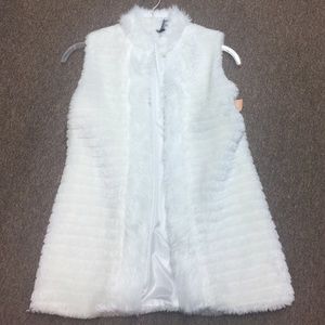 White fur vest